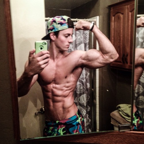 beautifulyoungmuscle:The stunning flexed biceps of Zach Zeiler. Piled high with muscle, studded with veins, rippling with mass and power, they’re erotic totems of beautiful young muscle.