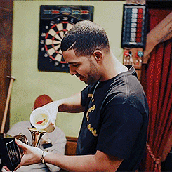 kathybethterry:  Drake doing shots out of his Grammy for Best Rap Album 
