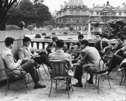  Students from the Sorbonne sit around a table in the Jardin