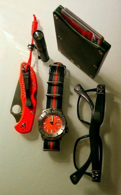 realworldedc:   Minimalist Everyday Carry.  Spyderco Delica4 in Orange FRN on 275lb. Paracord Lanyard and Stainless Steel Bead. Seiko Monster 200m diver Mechanical Watch Olight i3s aaa flashlight Chrome Hearts “Gittin Any?” Eyeglasses Minimalist Micarta