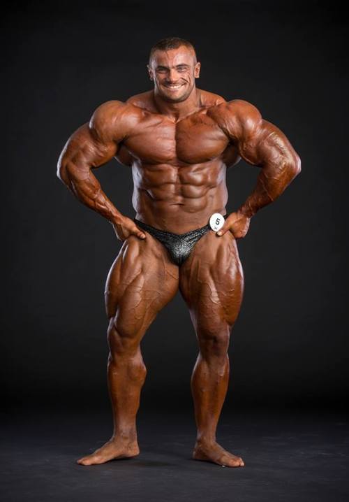sannong:    Tomas Kaspar - Part 1: Stage Shots. Holy fuck! The bulging road map veins covering every inch of his beautifully mutated legs, the monstrous, deeply striated and ripped traps, the shredded sucked in bodybuilder face that just scream raw power.