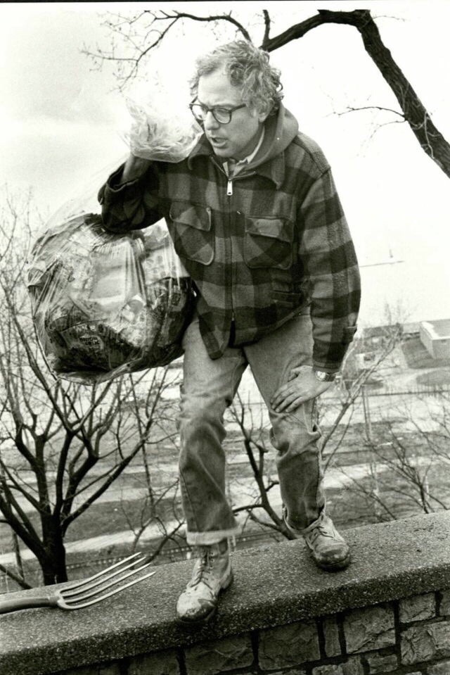 Burlington Mayor Bernie Sanders picks up trash on his own in a public park after