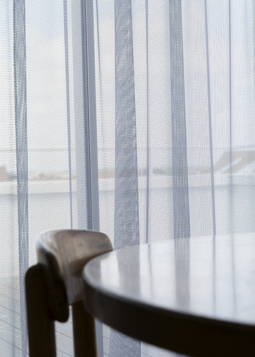 Fishnet curtain detail from Penthouse apartment in Knokke, Belgiumhttps://www.hohm.be/en/gallery/Pho