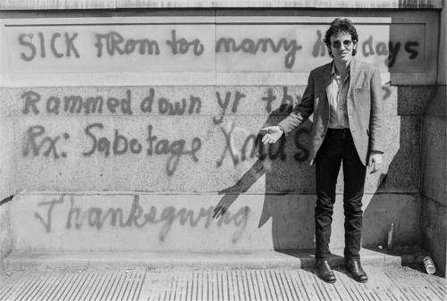 thewildandthedarkness: Bruce Springsteen in front of a wall with inscriptions, 1978Photos: Lynn Gold