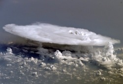 blazepress:  Above a storm over the sea.