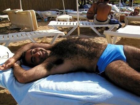 Hands and exceptionally hairy and a nice bulge - WOOF My kind of man