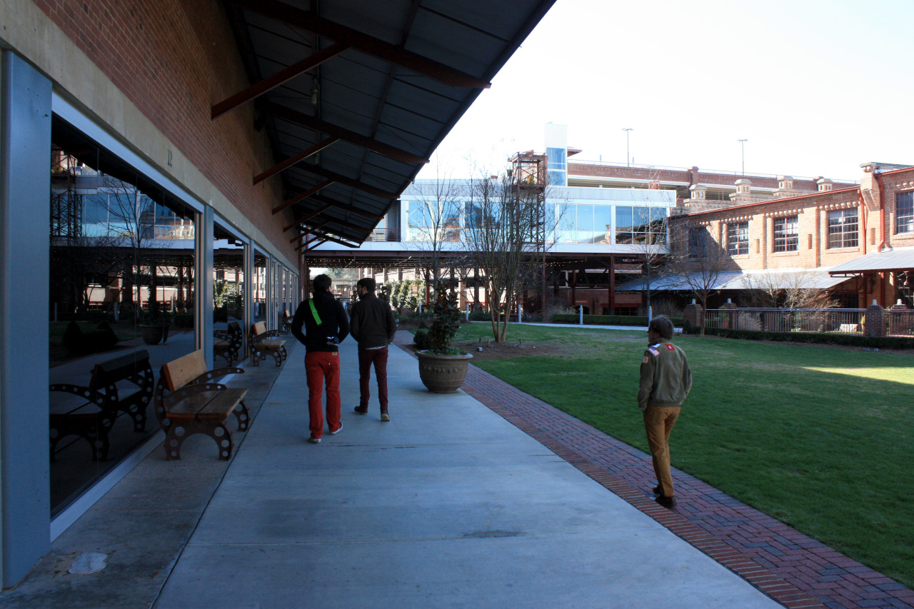 American Tobacco District with three boys in colored pants.