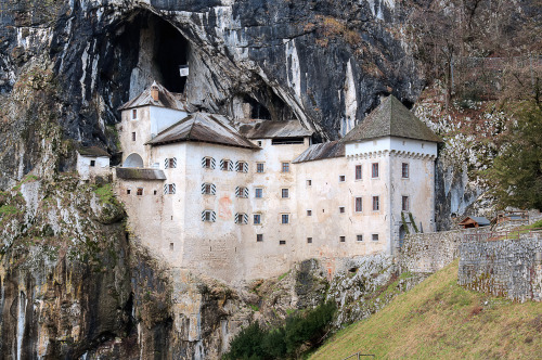 scentofapassion:  Predjama Castle by Meleah Reardon - This picturesque and impregnable castle has been perched up in the middle of a vertical 123-metre high cliff for more than 700 years. Its romantic appeal is further emphasized by the idyllic River