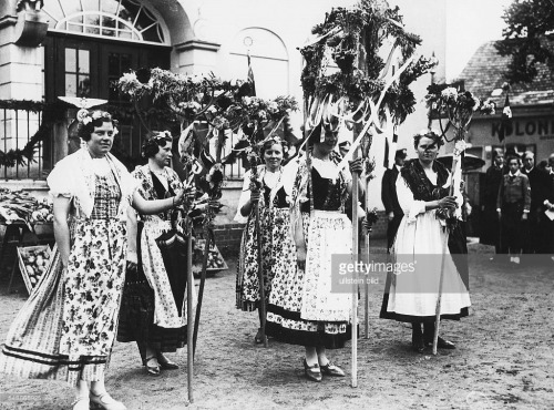 Women of a local costume group during Thanksgiving with a self made harvest crown in Marzahn, near B