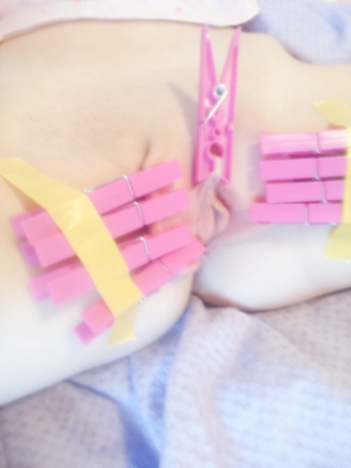 mynastyslut:  My little princess bought cute, new, painful pink pegs to hurt her little pink pussy for me. She knows I love it when she spreads so she used tape to spread herself wide hands-free, and the extra one on the clit was just to make me happy.