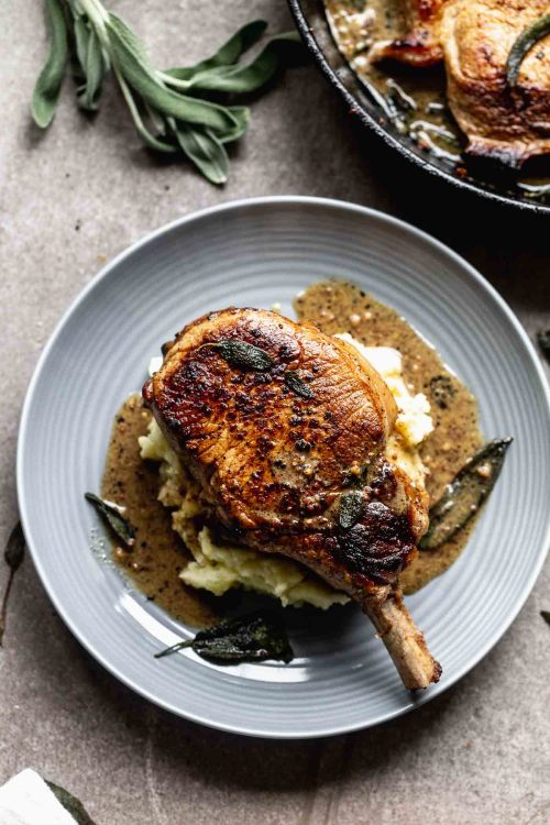 Pan-Seared Pork Chops with Apple Cider Cream Sauce and Goat Cheese Mashed Potatoes