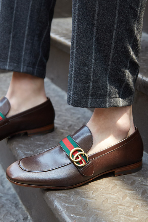 The timeless Gucci loafer gets a modern-day update with gold hardware and bold striped webbing. The 