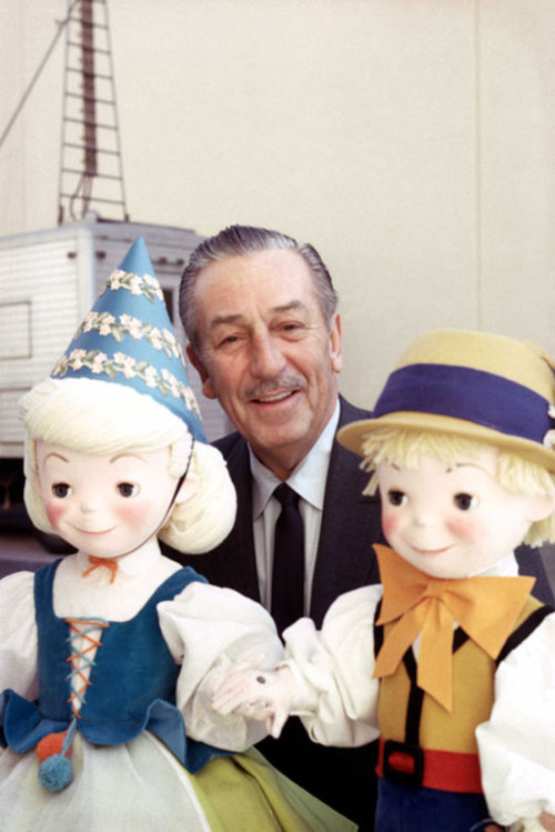 Walt Disney backstage with characters from it’s a small world