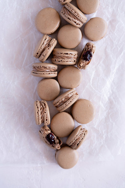 Chocolate Macarons with Dark Chocolate Swiss Meringue Buttercream and Cherry Compote Filling https:/