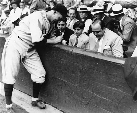 Al Capone receives an autograph from Chicago Cubs catcher Gabby Hartnett during the 1929 World Serie