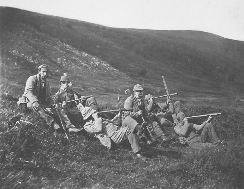 Portrait of a group of deer hunters posing on a hillside in Glenfeshie, Scotland, c. 1858. Taken by 