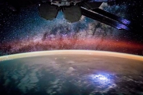 For the crew aboard the International Space Station (ISS), a section of the Earth at night is visibl