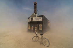 mistressaliceinbondageland:  reblololo:  Smithsonian Magazine’s 2013 Photo Contest - In Focus - The Atlantic Finalist, Americana category. Dust swirls around citizens of Black Rock City as they peek into the “Black Rock Bijou Theatre,” an art installation