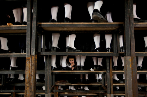 1:  Nov. 18, 2012 file photo, a Palestinian man kisses the hand of a dead relative in the morgue of 