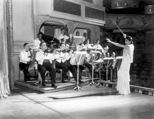 Valaida Snow (1904-1956), a renown musician and composer, conducting an orchestra in London. October