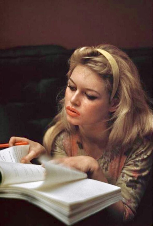 talesfromweirdland:Brigitte Bardot diligently studying a script.Though she never really liked acting