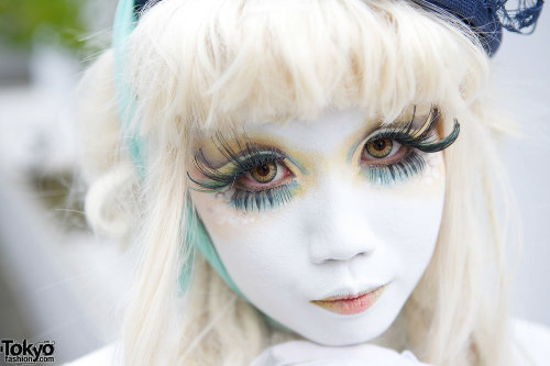 Japanese shironuri artist Minori on the street in Harajuku in summer of 2014 wearing a handmade/rema