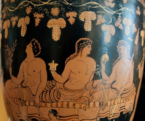 Apollo, Dionysus, and Hermes at a banquet.  Apulian red-figure situla, by a painter of the Group of 
