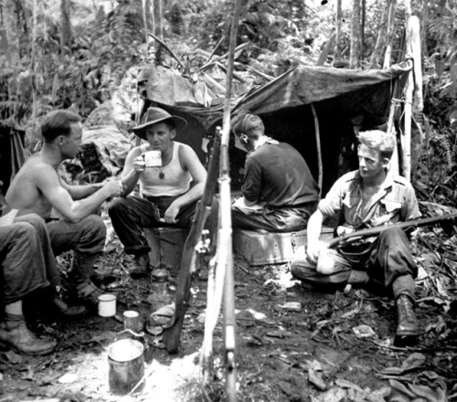 Australian Army soldiers are photographed at rest in their jungle outpost during the Salamaua-Lae Ca