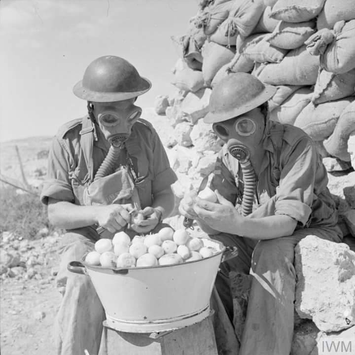historicaltimes: British soldiers equipped for peeling onions. North Africa, 1941