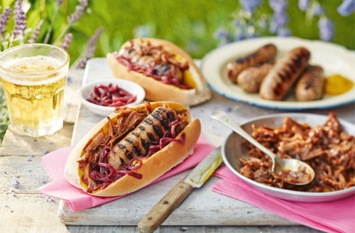 Hot dogs with pulled pork and red onion relish