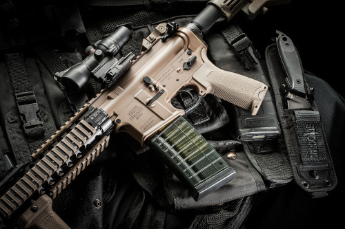 stickgunner:  Bravo Company USA Limited Edition FDE Carbine with Heckler & Koch magazine, and Trijicon, Inc. ACOG. The blade is the DPx Gear HEFT 4 Assault. The carrier is one I wore way back in Desert Storm. 