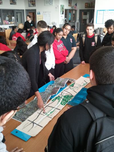 Helen Ho leads a workshop for high school students, getting their ideas about how the Queensway could become a new public open space.