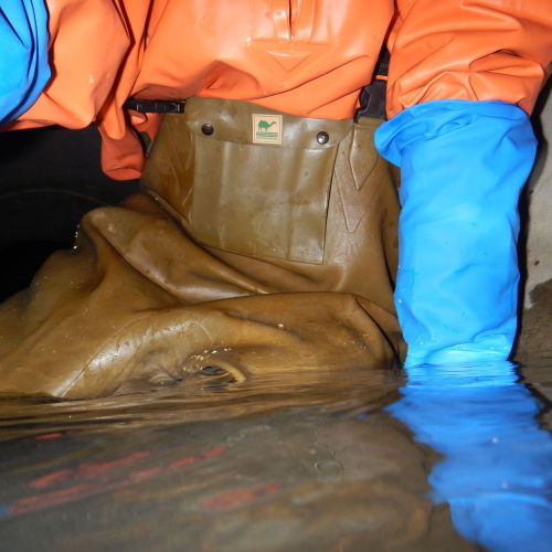 kanalgummi: An older photo: comfortably sitting in a narrow sewer in my favourite rubber pants