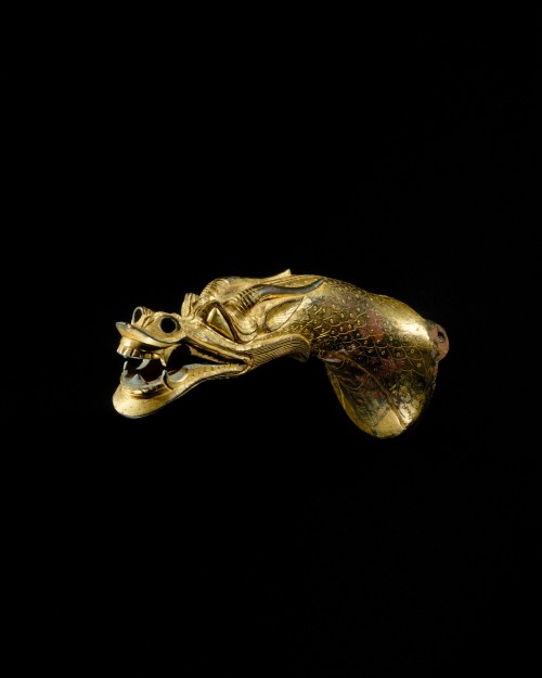 An ancient Chinese handle in the shape of a dragon&rsquo;s head. This artefact dates to the 