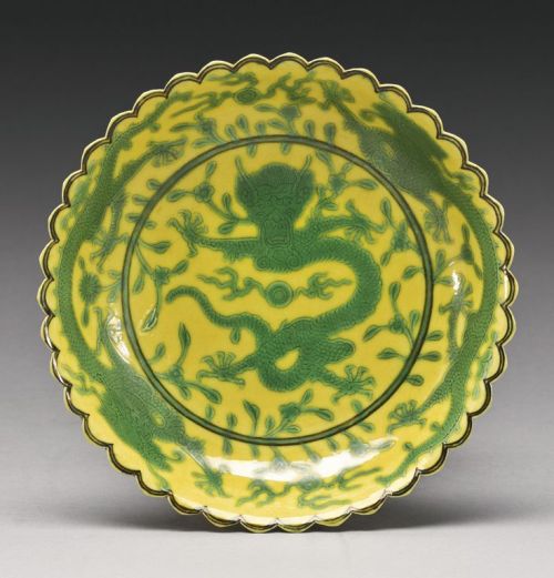 A yellow-ground green-enameled dragon foliate dish and bowls. Qianlong seal mark, Qianlong period