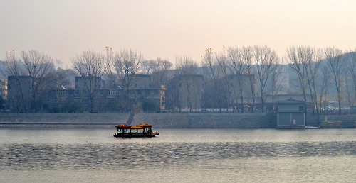 A tour boat going up the Yehe River at the Longmen Grottos, located at Luoyong, Henan Provence, Chin