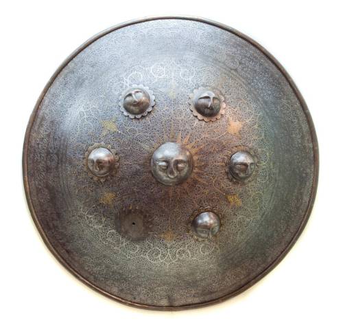 Shield made of Damascus steel, with gold inlay and seven face-shaped studs. Azerbaijan, Safavid peri