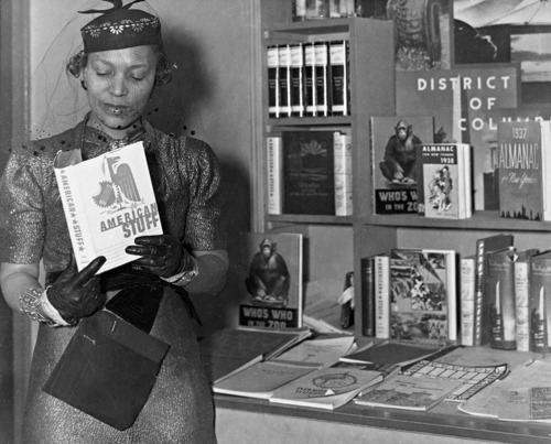 Zora Neale Hurston at the Federal Writers Project booth at the New York Times Book Fair, 1937. The b