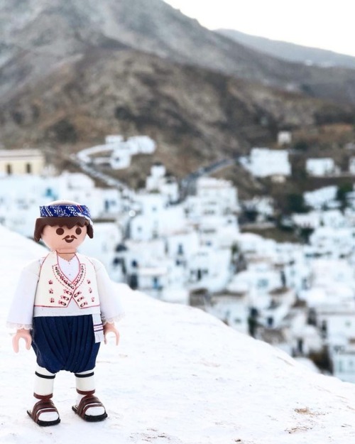 Shepherd playmoGreek with his folk costume in Skyros, Greece. By artist Petros Kaminiotis who create