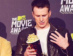 christinahendricks:  chris evans is awkward and doesn’t know how to pose with this popcorn  but I love him