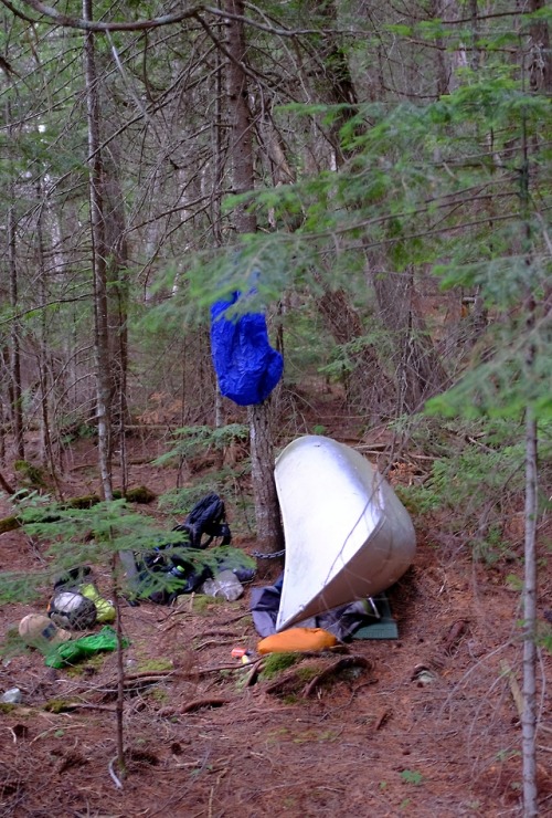 only the coolest hikers sleep under canoes.