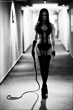 uncollared-m:  myslutbelongstome:  This is totally unlike Me, especially the whip…but I love Her look of determination.  Her slut is in for the time of his life :)  no prisoners today.