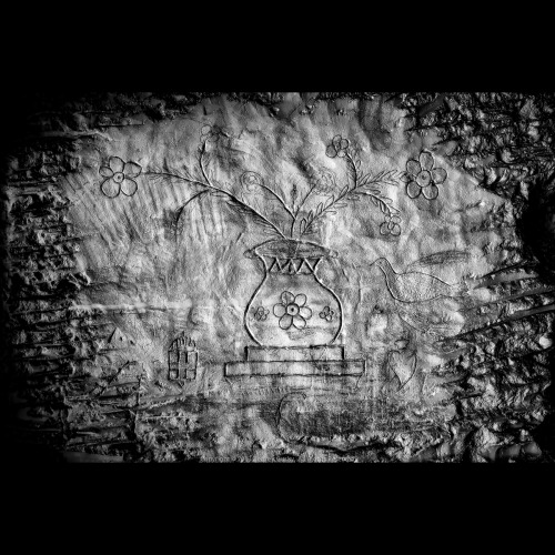 Vase and flowers inscribed by Italian WWI soldier in vast underground city near the front lines.