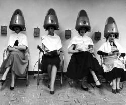 roicru:  Women sitting and reading under hairdryers at Rockefeller Center “Pamper Club”, where hair driers cost 10 cents for 15 minutes. 