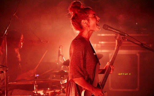 “The live shot is Jenny, killing it as per usual, at a show in Hamburg”. Photo by Robin Laananen.