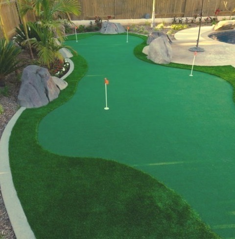 Landscape In Orange County Inspiration For A Large Tropical Rock And Partial Sun Backyard Stone And Wood