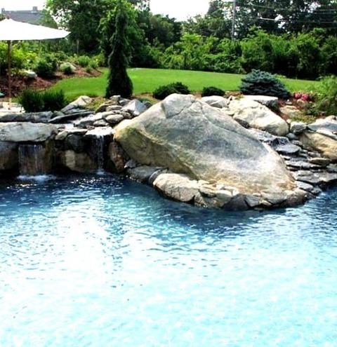 New York FountainMid-sized Minimalist Backyard Stamped Concrete And Custom-shaped Pool Fountain Photo