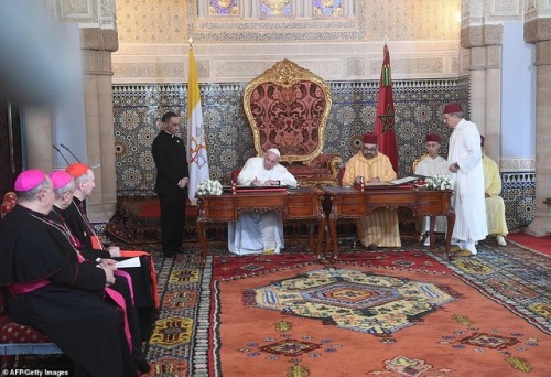 Pope Francis and King Mohammed VI of Morocco attend a signature ceremony at the Royal Palace in the 
