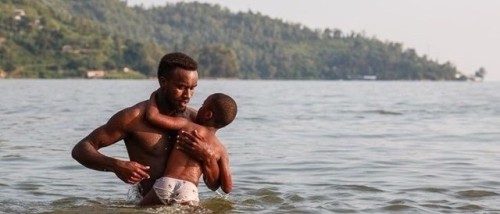 olordelaguayaba: A father teaches his son to swim at Lake Kivu, Rwanda, by David A. Wilson.Moonlight