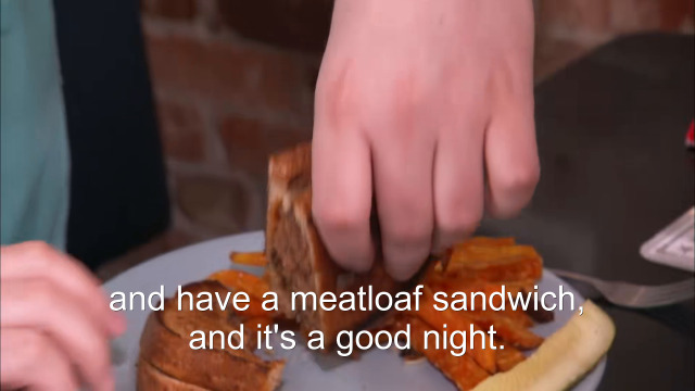81% sure it's a sandwich cut in half on a plate. Caption: and have a meatloaf sandwich, and it's a good night.